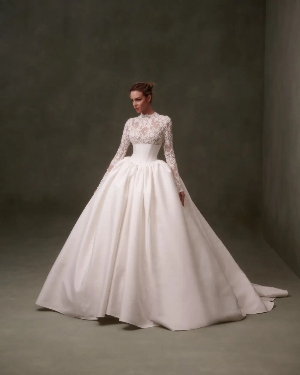 1730139233345-image-4-5 NF088, an ivory and nude long-sleeve ballgown with a high-necked lace bodice, delicate lace sleeves, and a voluminous mikado skirt, exuding classic romance and contemporary elegance.