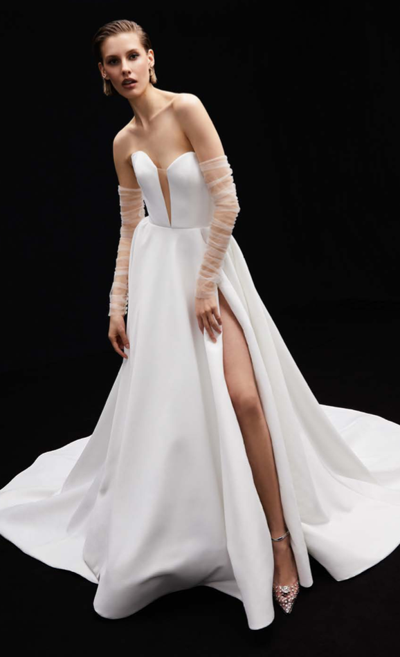 Stella - This exquisite A-line gown, made from luxurious matte satin, features a deep sweetheart neckline that beautifully frames the décolletage.