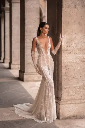 Stunning long lace gloves complement the overall design, creating a seamless and glamorous look.