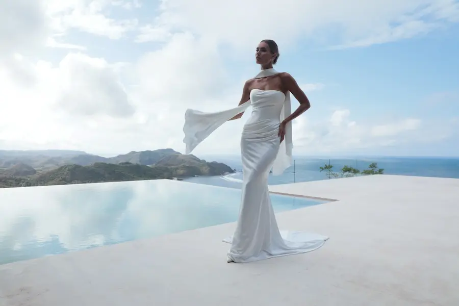This one-of-a-kind gown is exquisitely designed from fluid satin, creating a graceful, organic drape that flows naturally and beautifully