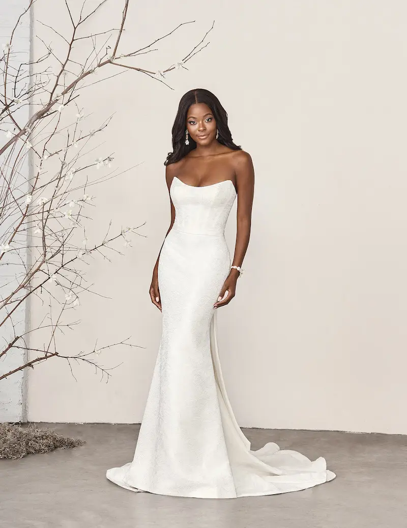 Melrose - Hugging the body through the bodice and hips, the gown elegantly flares below the knee, creating a flattering shape that blends modern style with classic appeal.